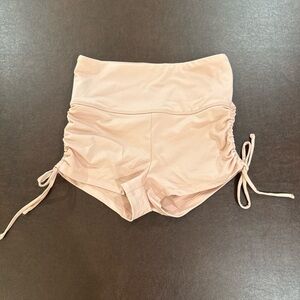 High-waisted pink athletic booty shorts with adjustable ties size small